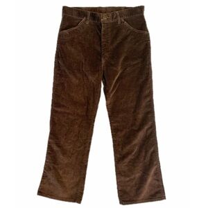 Brown corduroy straight leg trousers with patterned pockets